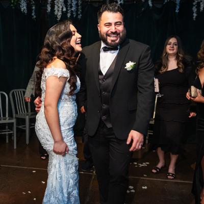 Interior,  joyful bride and groom share a laugh