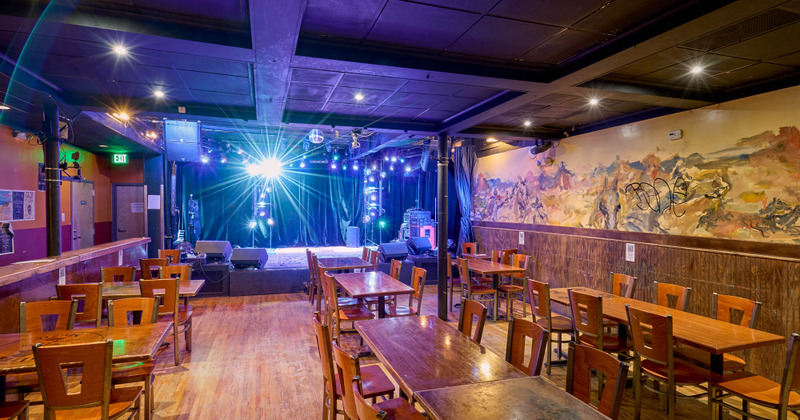 Interior, dining area and a stage in the back