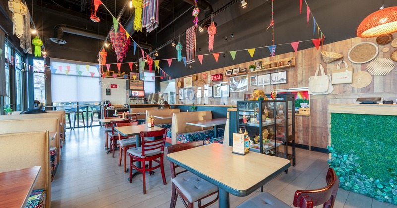 Interior with colorful decor, booths, tables and a vibrant, lively atmosphere