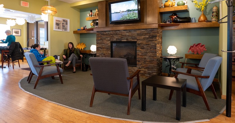 Rest room, armchair, fireplace, tv screen above