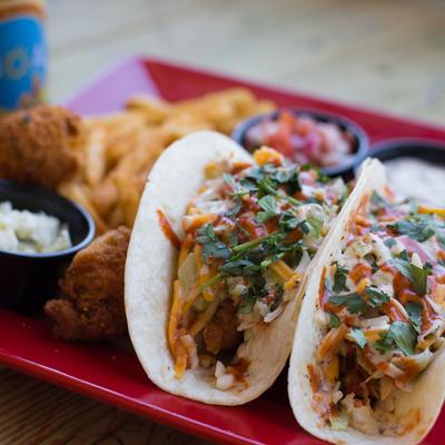 Three Soft Tacos featuring Mahi Mahi, Popcorn Shrimp, Chicken, or Alligator Tail.
