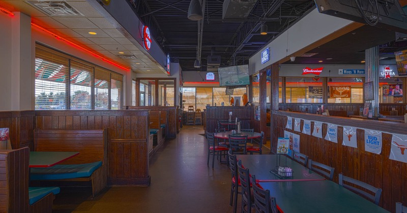 Interior, mixed seating area, seating booths, regular tables, divided dining area