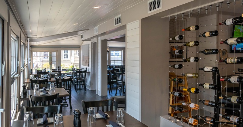 Diner area, tables and chairs, wine wall