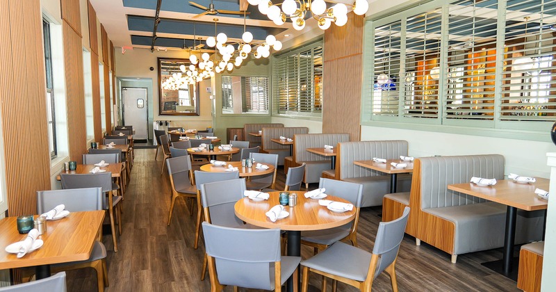 Interior, tables and chairs in dining area