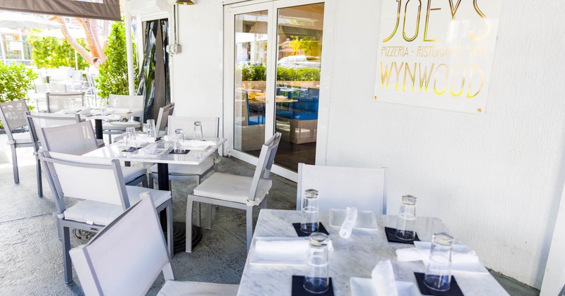 Exterior, covered seating area, tables and chairs