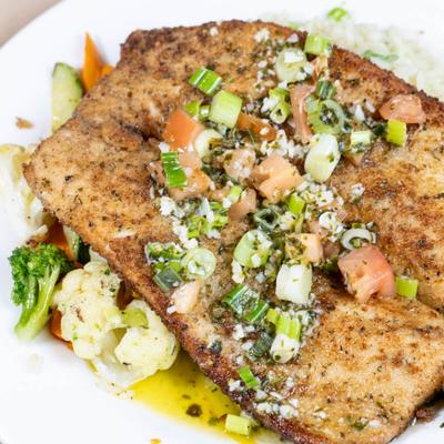 Chicken tenders and veggies, closeup.