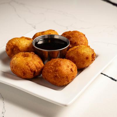 Fried dough fritters and dip.