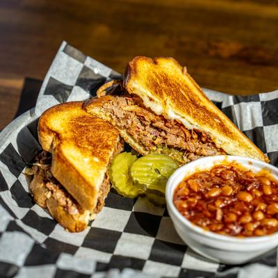 Spicy Grilled Cheese served with beans on the side.