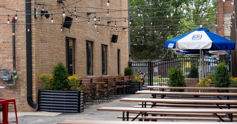 Exterior, sideyard patio, table, benches, parasols