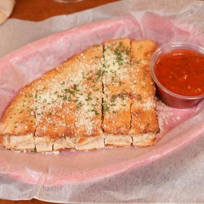 Bread sticks served with dip.