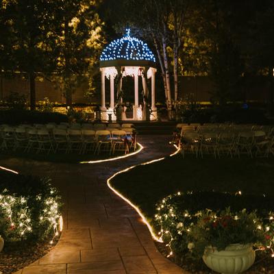 Yard at night lit with lights