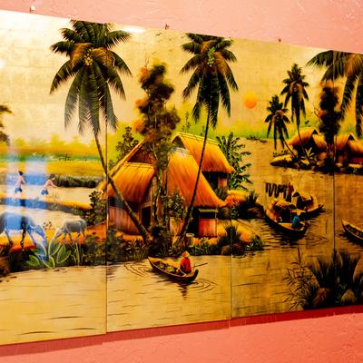 Painting depicting a fishing village.