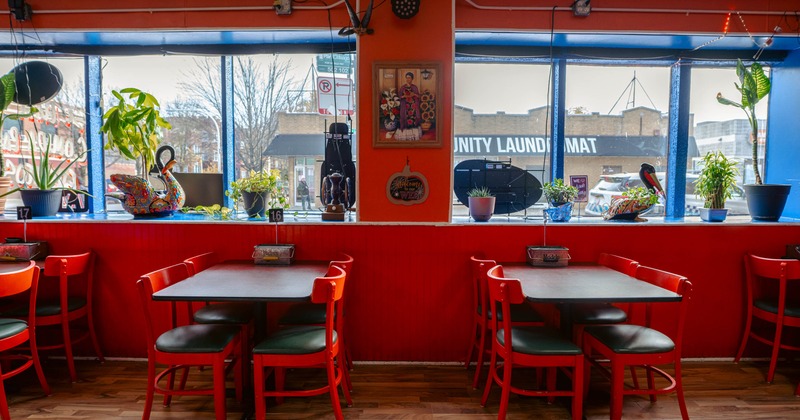 Interior, tables with chairs near the windows