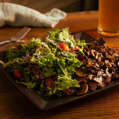 Mixed greens salad with mushrooms.