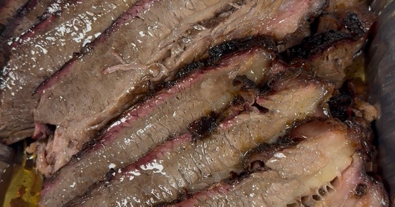 Sliced brisket served in catering tray