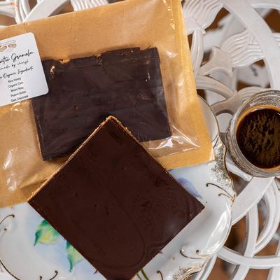 Two granola bars served with coffee.