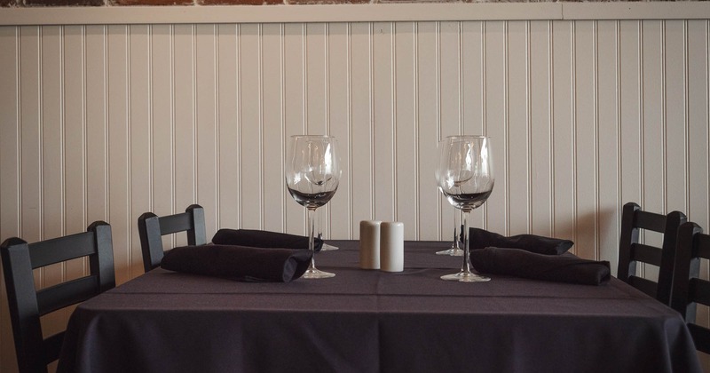 Interior, detail of table set for guests