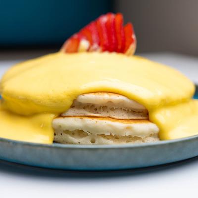 Pancakes topped with mango cream sauce.