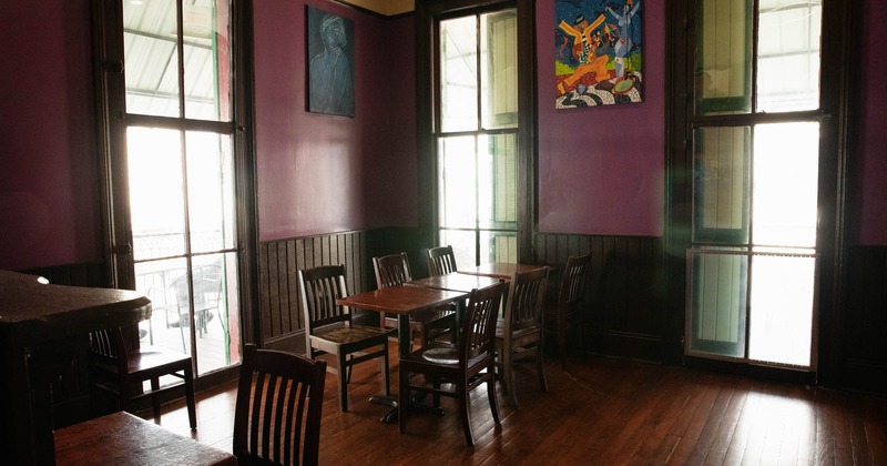 Interior, a table in the corner next to the big windows
