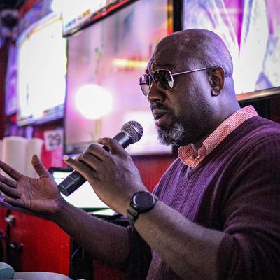 A person singing into the microphone.