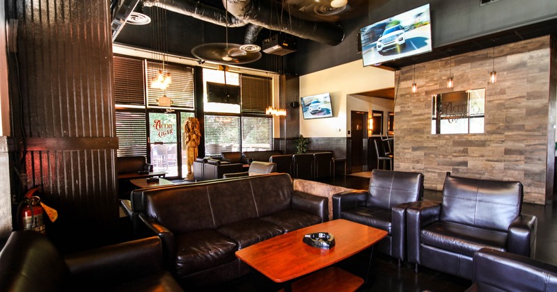 Interior, upholstered leather sofas and armchairs, TVs