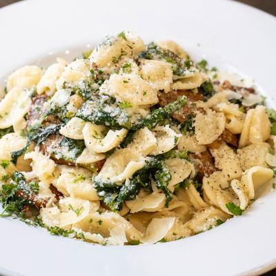 Bow tie pasta with broccoli rabe and sausage in garlic and oi.
