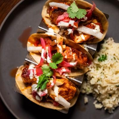 Chipotle Honey Salmon Tacos served with rice, top view.