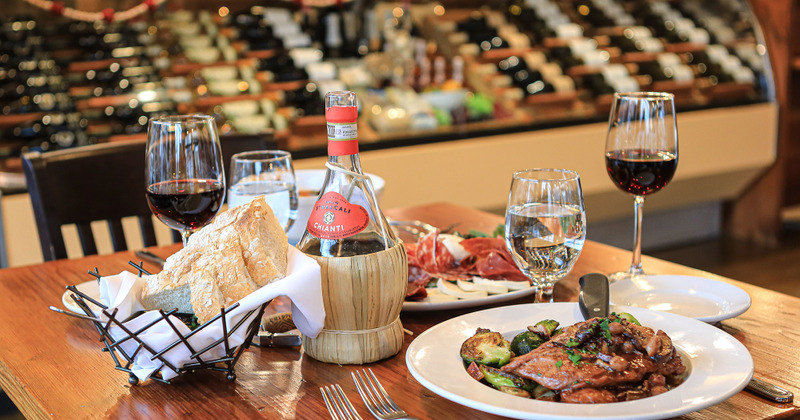 Several meals served on table with beverages