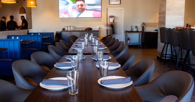 Interior, dining area, wooden top tables for six, leather padded chairs, ready for gusets