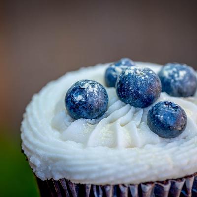 Blackberries in cream on a muffin.