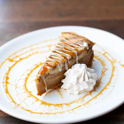 Salted Caramel Cheesecake, with whipped cream.