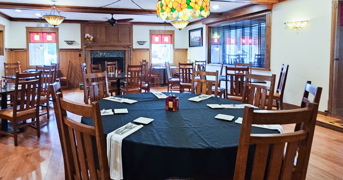Interior, set round tables and chairs ready for guests