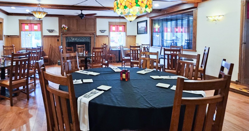 Interior, set round tables and chairs ready for guests