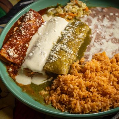 Bandera enchiladas served with rice and beans.