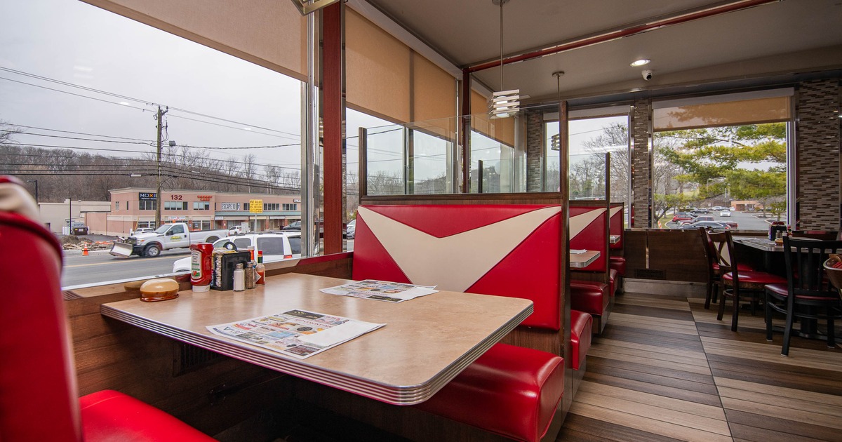 Cozy diner with retro red booths and a wooden floor