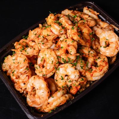 Pound of Shrimp in a takeout container.