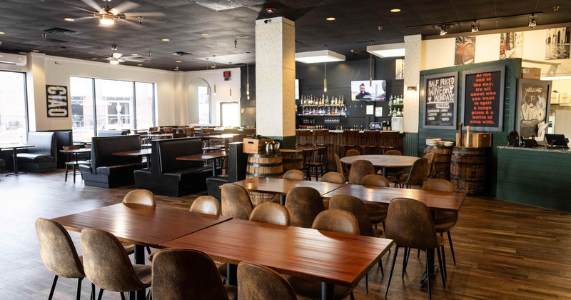 Interior seating area with chairs, tables and double booths