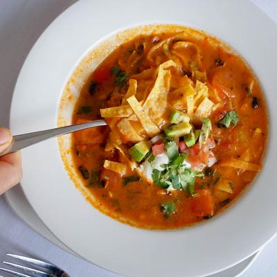 Tortilla soup, with chicken, avocado, cilantro and sour cream