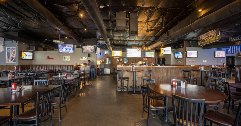 Interior, chairs and tables, bar area in the background