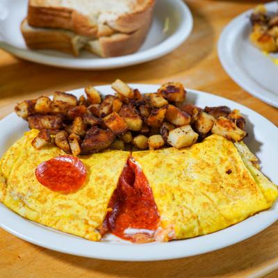 Omelette filled with cheese and pepperoni, served with home fries.