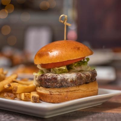 Cheeseburger accompanied by fries.