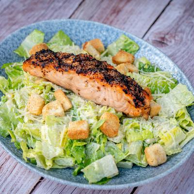 Caesar salad with salmon.