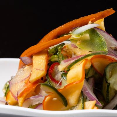 Mango cucumber salad with red onion and carrot.