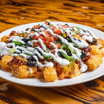 Plate of loaded tater tots.