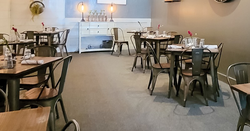 Dining tables ready to receive guests