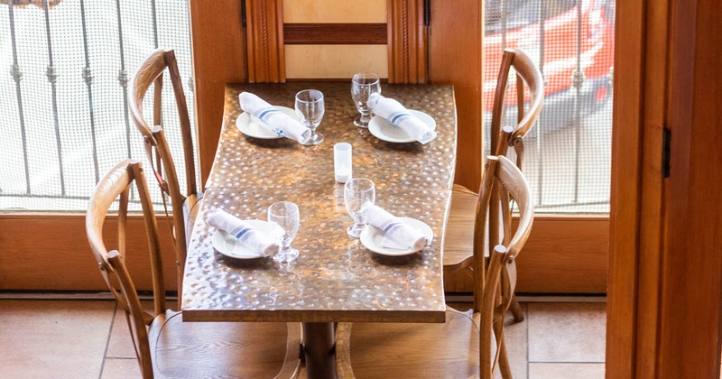 Interior, dining table set for four guests
