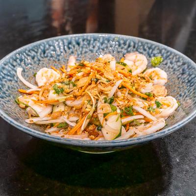 Shrimp and cucumber salad in bowl.