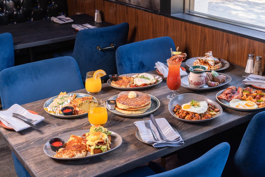 A table set with various foods and drinks