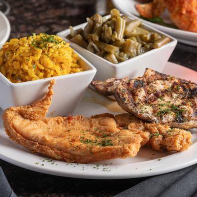 Turkey chops served with rice and green beans.
