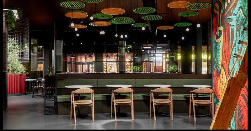 Open booth seating beneath decorative circular ceiling accents